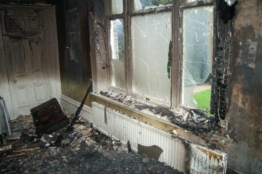 unattended candle fire insurance coverage